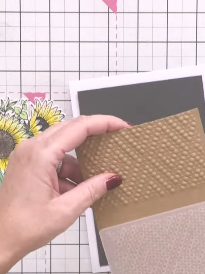 Step 2: Turn the embossed card around and run it through the embossing folder again in the opposite direction, creatin