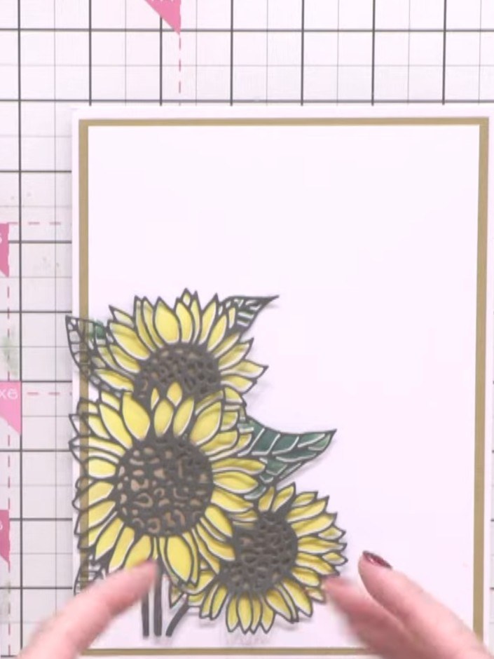 Step 1: Stamp the sunflower image from the A6 stamp set onto white or light pink cardstock using grey or black ink. Po
