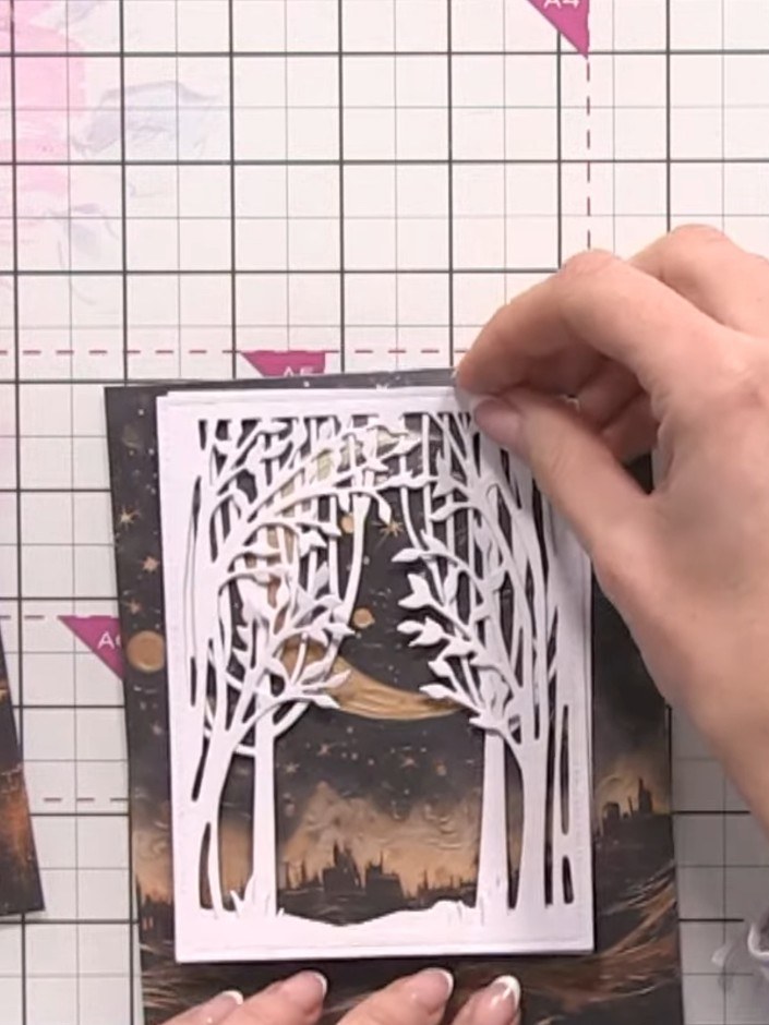 Step 4: Trim the landscape paper to size and layer it onto your white card base. Position the landscape paper behind t