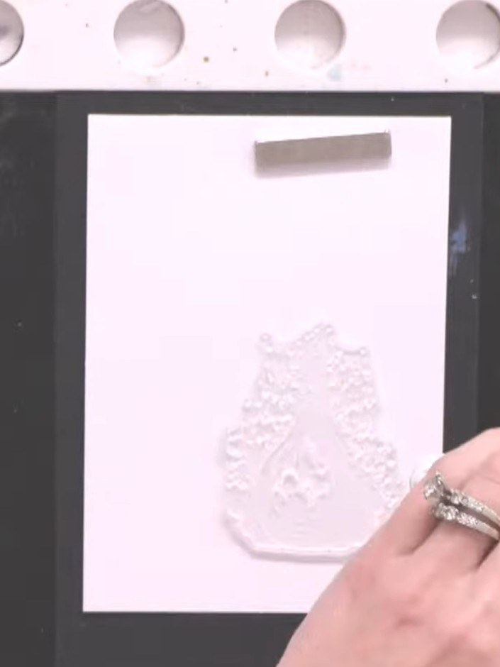 Step 4: Using your finger, gently push and blend the wet inks together on the stamped image to create a smokey, waterc