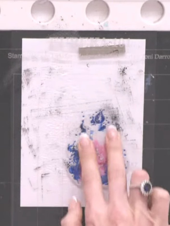 Step 5: Allow the card to dry completely. Once dry, use your fingers to blend and push the colours together on the sur