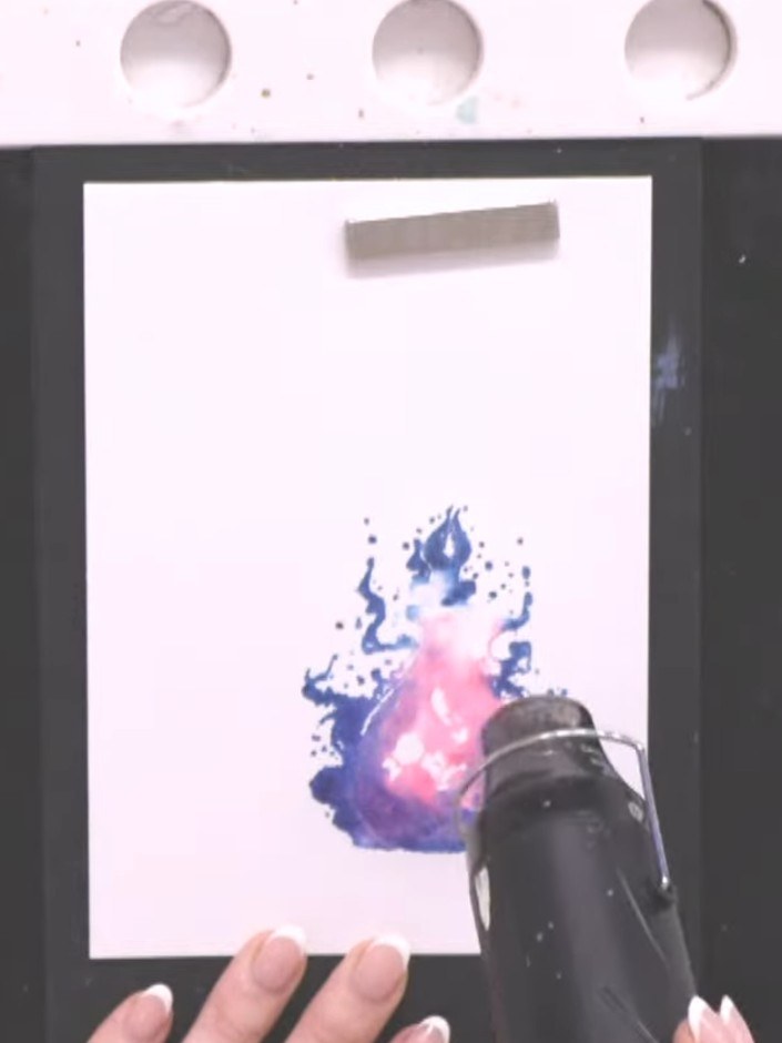 Step 6: Stamp the detailed black outline portion of the potion bottle stamp on top of the blended watercolour backgrou