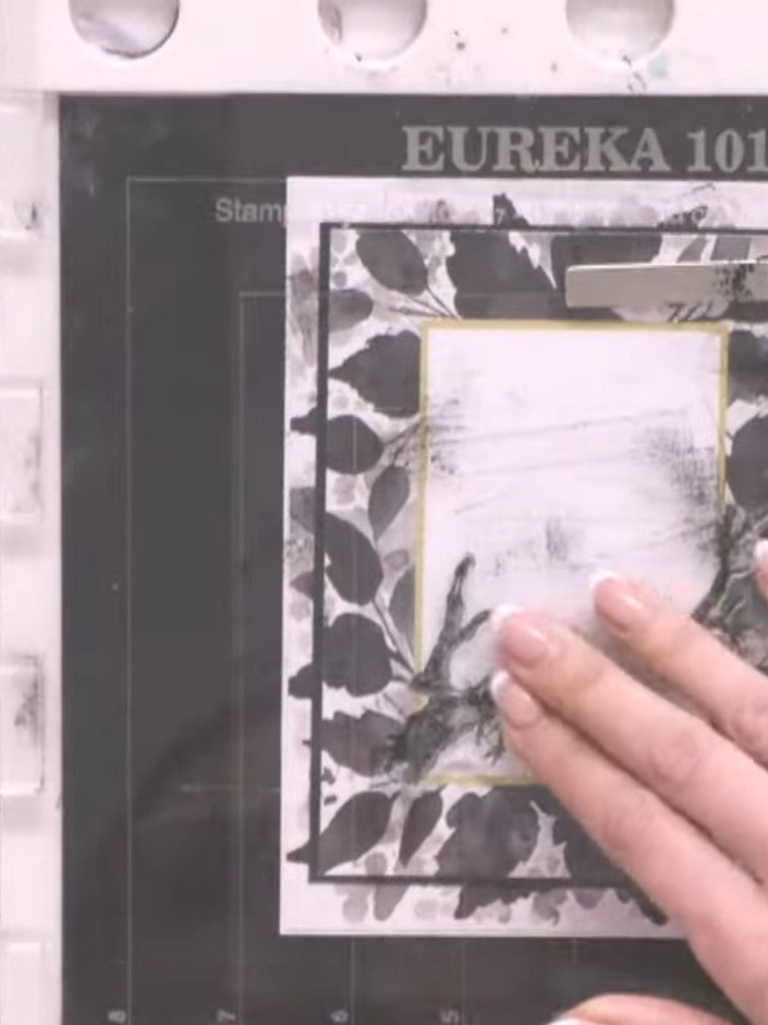 Step 1: Stamp the branch detail onto white card using grey ink, positioning it as a background element within the fram