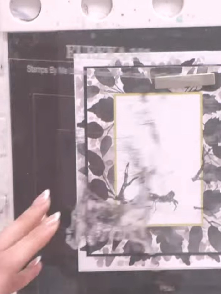 Step 2: Stamp the bird silhouette onto the same white card using black ink, positioning it so it aligns with the branc