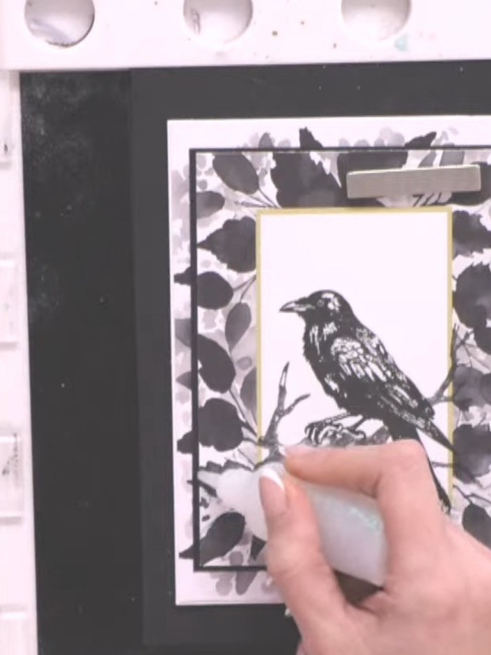 Step 6: Apply black sparkle glitter glue around the edges of the frame to add shimmer and definition. Work carefully a
