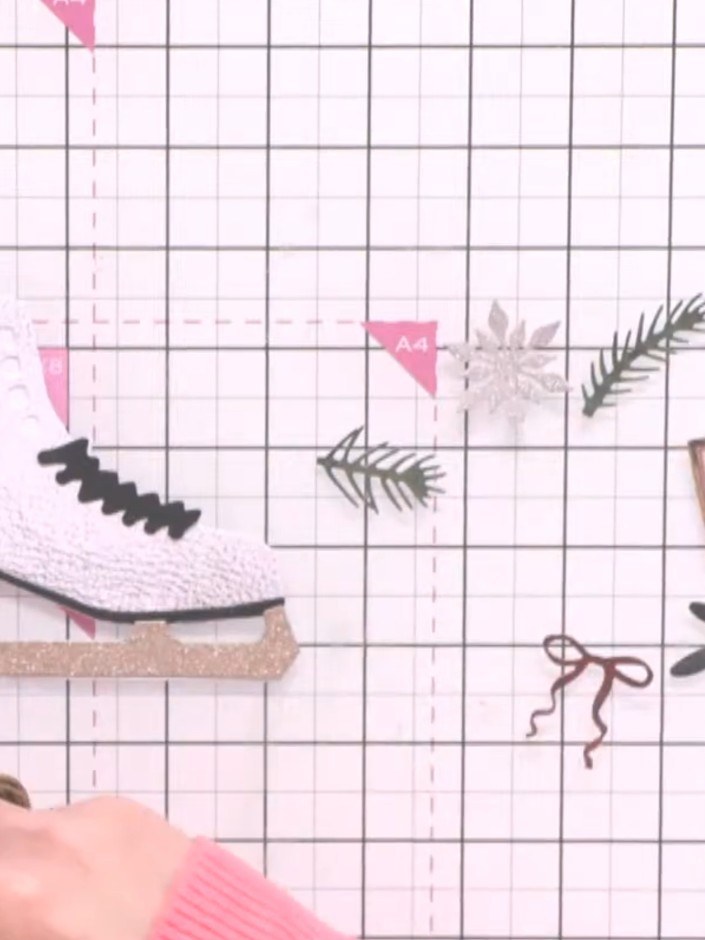 Step 7: Die-cut foliage, berries, buds and flowers from the textured papers included in the kit. Arrange the die-cut e