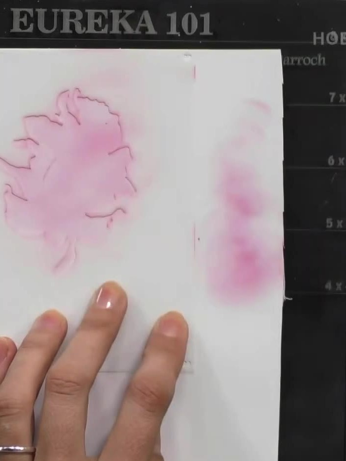 Step 3: Position the second layering stencil over the perfume bottle image. Apply yellow ink to the perfume bottle top