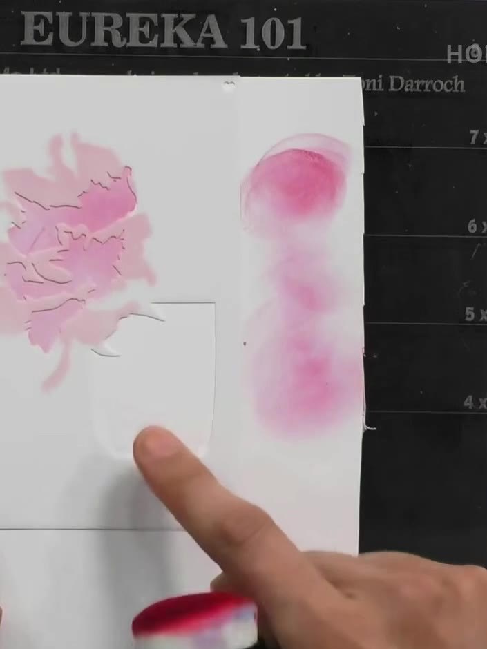 Step 4: Apply green ink through the stencil to create the leaf details on the flower image. Use a blending tool to app