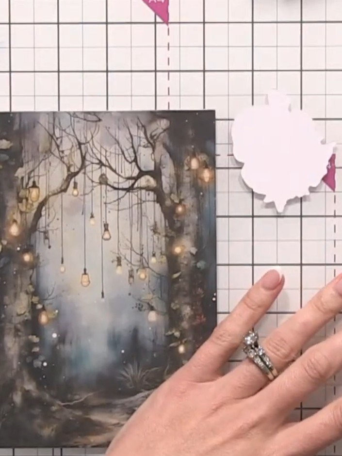 Step 2: Select a fairy topper from your kit. Position it on the right side of the card base to check placement before 