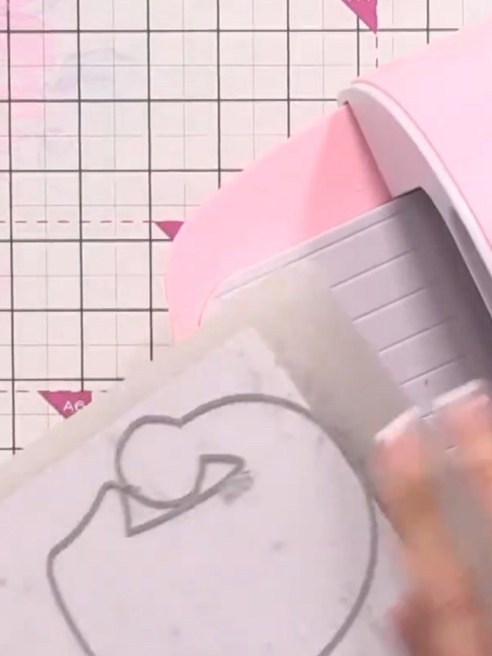 Step 2: Place your stamped card into the die-cutting machine with the hat die positioned over the top. Run the die thr