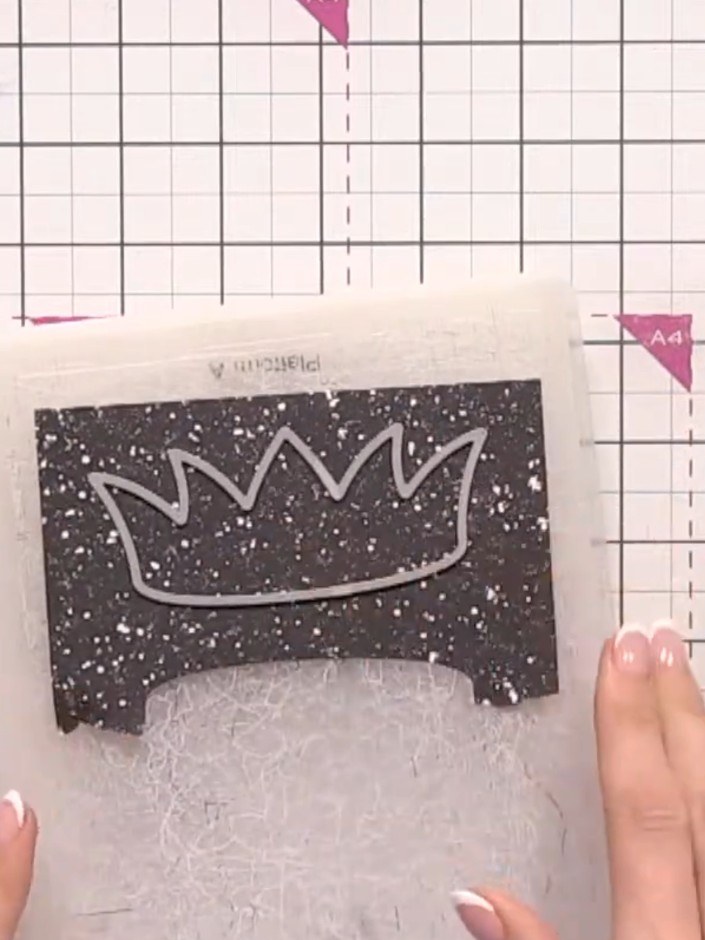 Step 4: Cut trim pieces from black glitter paper for the hat brims. Position the black glitter paper behind the crown 