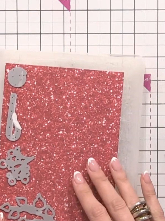 Step 5: Cut candy cane shapes from red and white glitter paper in various sizes using the die-cut pieces as a guide. C