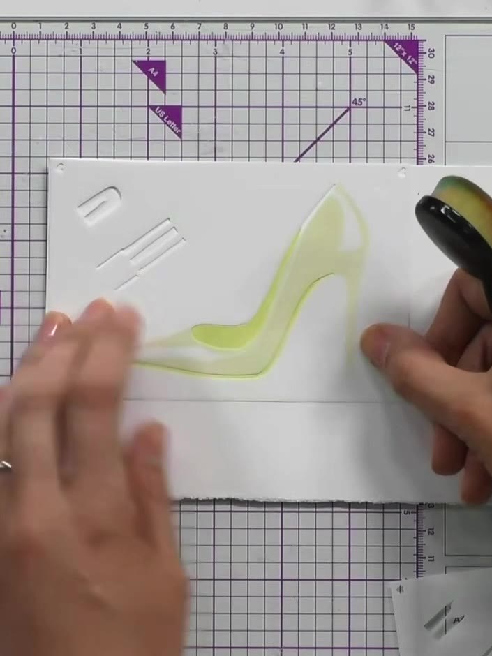 Step 3: Apply the third stencil layer using gold ink and a blending tool. Press down firmly to create light and shade 