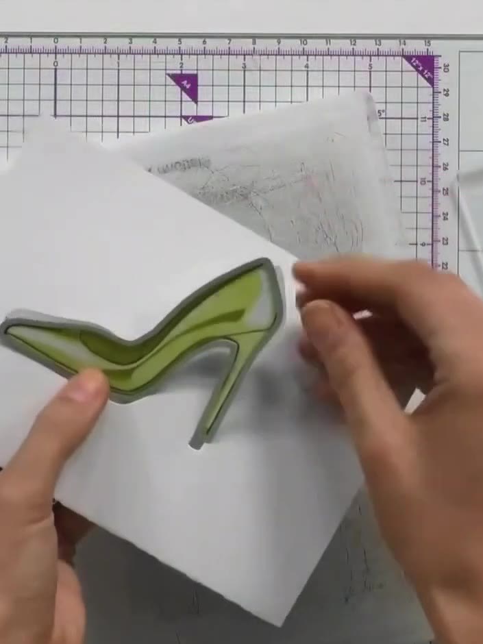 Step 5: Die-cut the shoe shape using the die-cutting machine with the fat plate on the bottom and thin plate on top. F