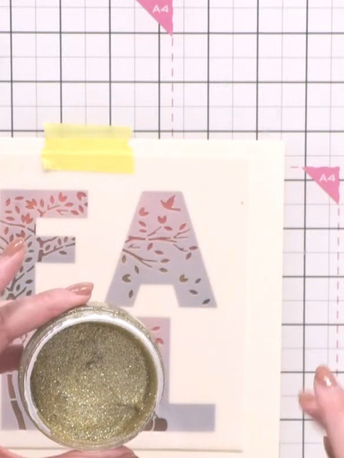Step 3: Apply champagne-on-ice Stella paste through the overlay stencil using a palette knife, spreading it evenly acr
