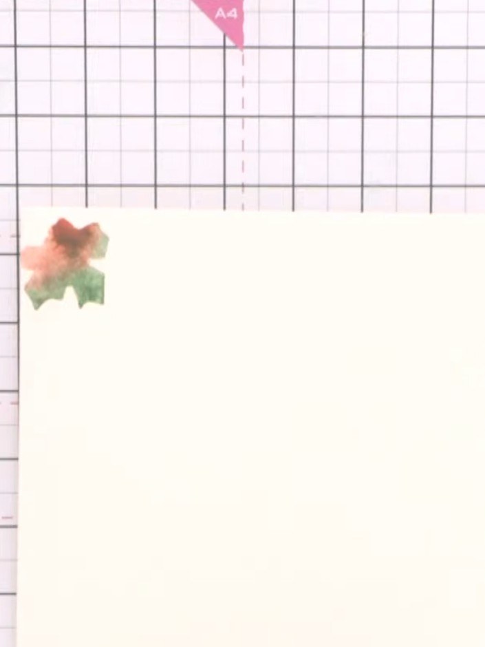 Step 4: Stamp the watercoloured leaf image repeatedly across your card panel to create a scattered leaf background pat