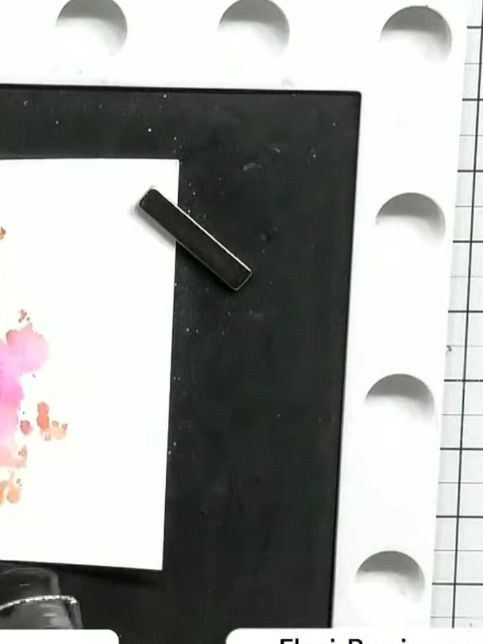 Step 6: Carefully lift the stamp away from the white card to reveal the watercolour gown design in pink and orange ton