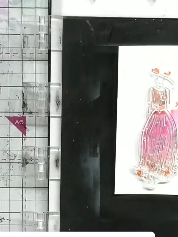 Step 9: Stamp the detail layer over your watercoloured gown using black or gold ink. This adds definition and outline 
