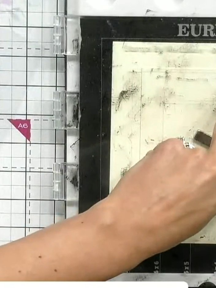 Step 7: Press the stamp firmly onto the card stock and hold briefly to transfer the design. Ensure even pressure acros