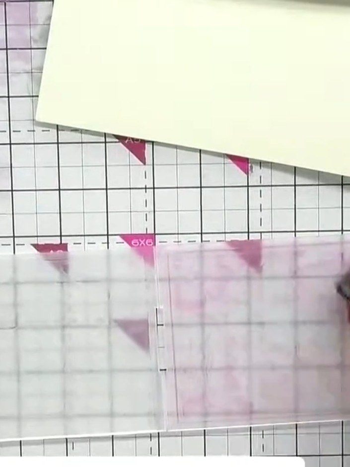 Step 2: Ink both sides of the embossing folder with a pink or coral ink pad, pressing the pad into all the crevices to