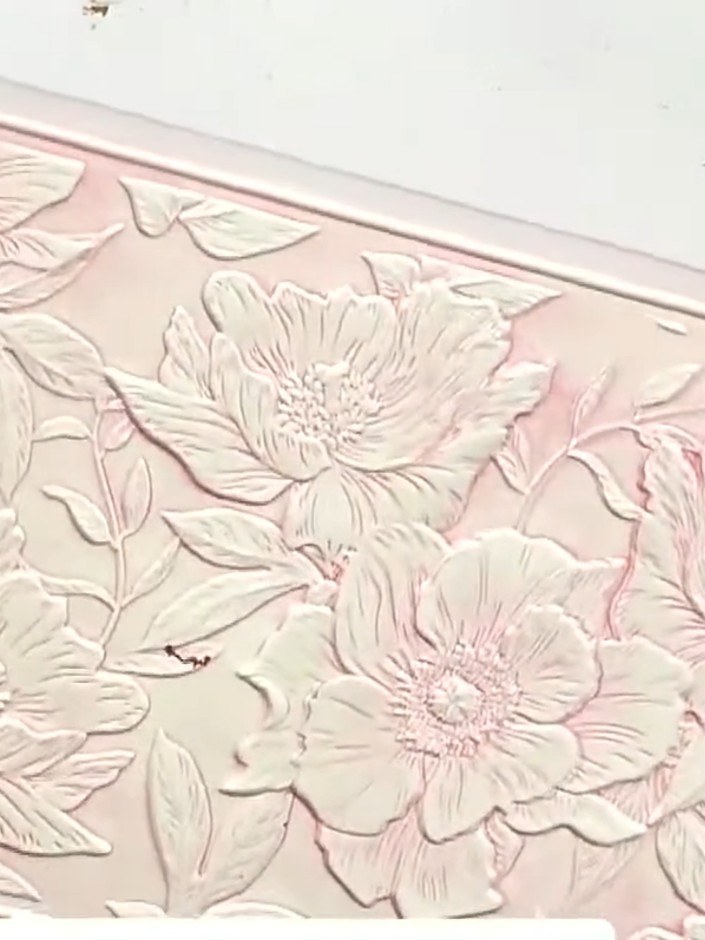 Step 9: Once the embossed panel is dry, apply interference wax to the raised areas by gently rubbing it onto the embos