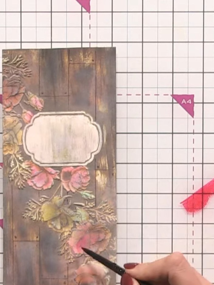Step 10: Add darker pink and orange tones to the centres of the flowers using a brush or applicator to create dimension