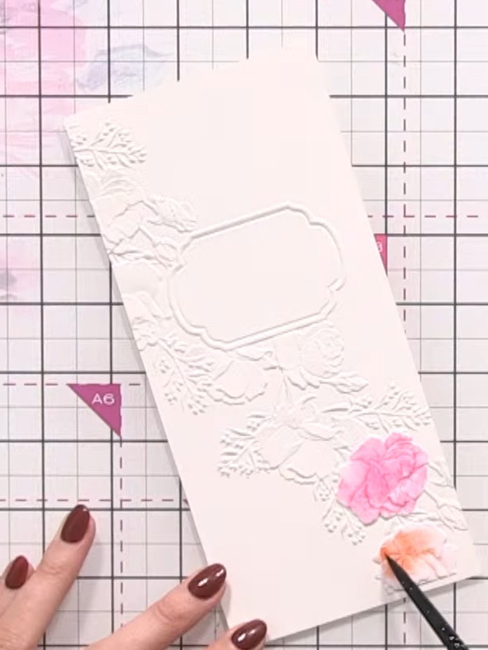 Step 4: Add colour to the leaves and stems using green ink with water to create soft, blended colour. Use a brush to a