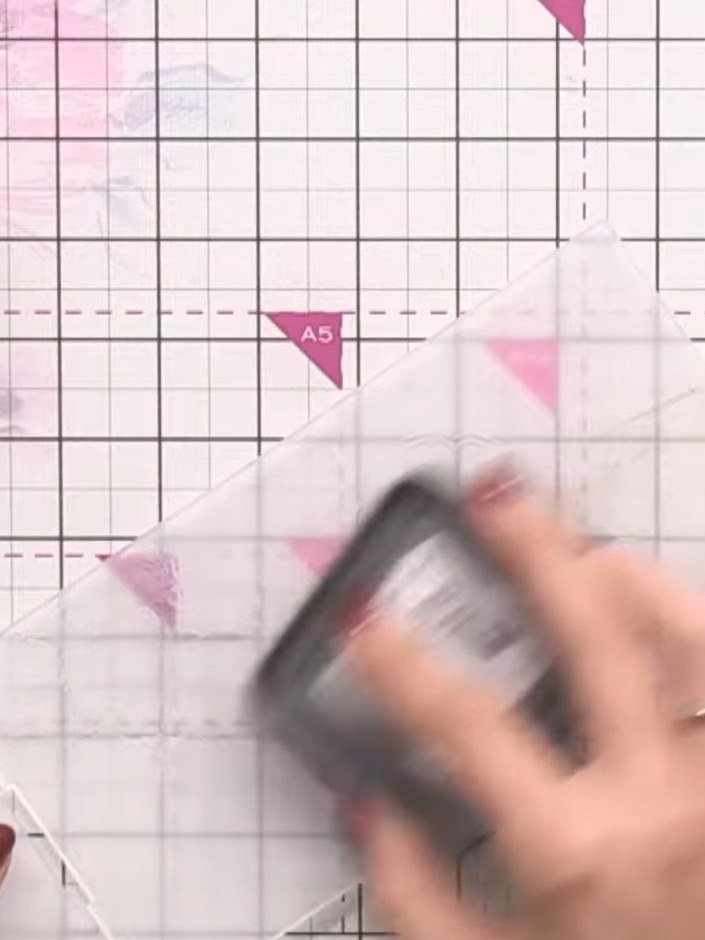 Step 6: Ink the embossing folder with brown distress ink, swiping the ink pad across the entire textured surface to cr