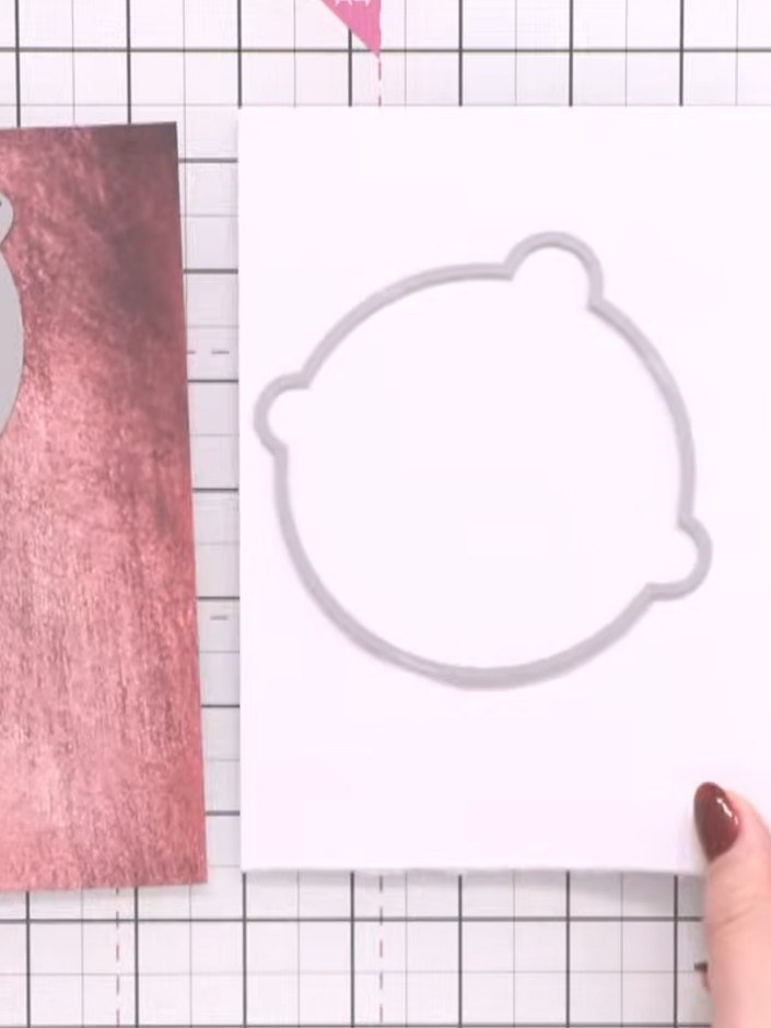 Step 2: Cut a second bell shape from white cardstock using the same die. This will form the exterior of your bell deco