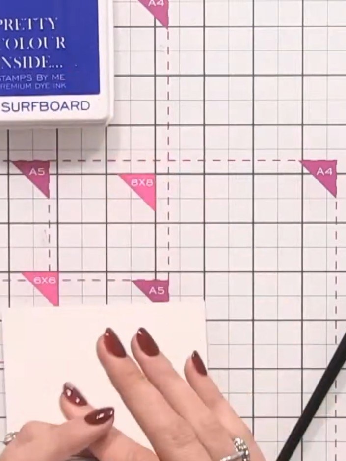 Step 1: Cut a piece of watercolour card to A5 size, then cut it in half to create two smaller pieces.