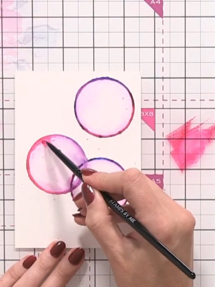 Step 8: Drop additional ink colour into the wet areas of each bubble to add depth and dimension. Allow the colours to 