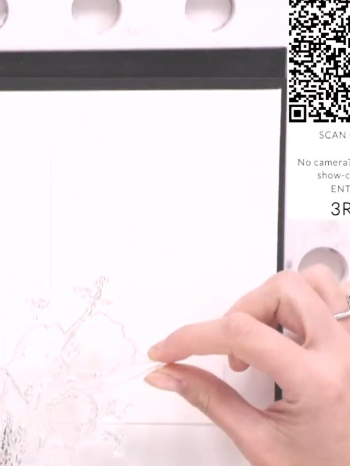 Step 2: Position the solid portion of the Doing Great stamp on the side of the white card panel, offsetting it slightl