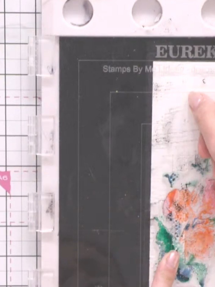 Step 3: Spot pink and orange ink pads onto the flower heads of the stamp, allowing the colours to blend naturally on t