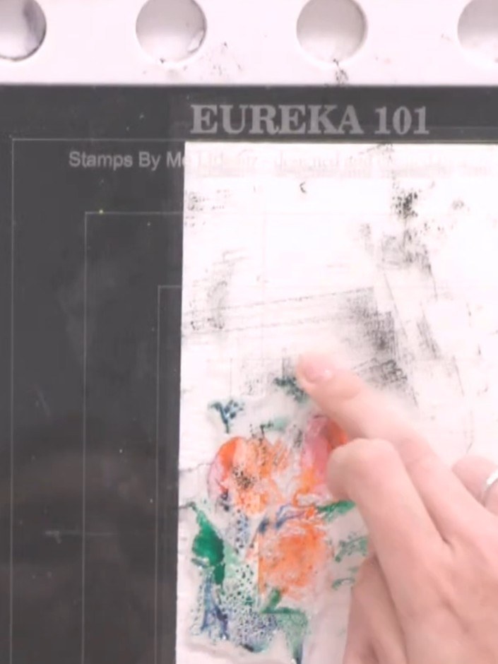 Step 5: Spray the inked stamp with water two to three times to activate the watercolour effect. The colours will begin