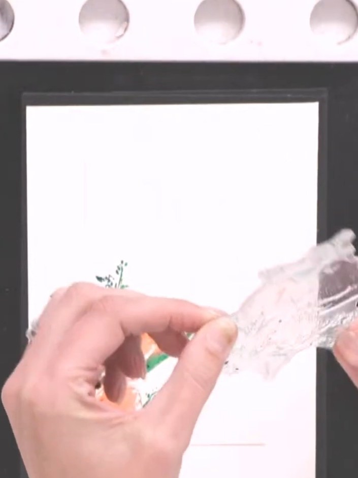 Step 7: Use a heat gun to dry the watercoloured floral design completely, setting the inks before proceeding to the ne