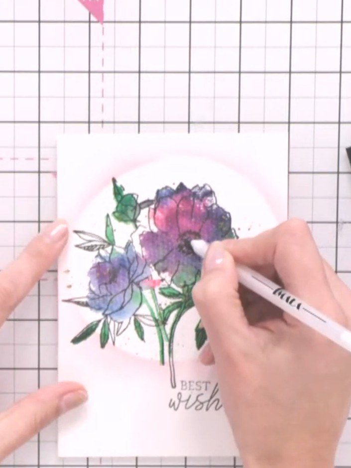Step 12: Use a white gel pen to add detail to the flower centres and enhance any lost design elements on the watercolou