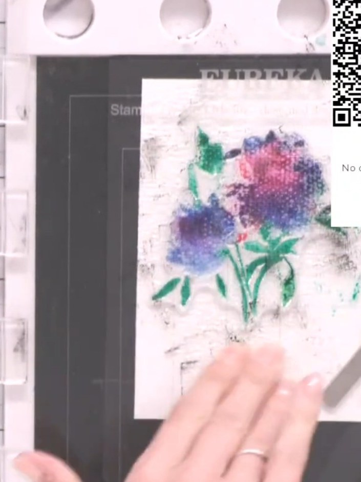 Step 5: Spray the inked stamp with water three times using a water sprayer to activate the watercolour effect on the m