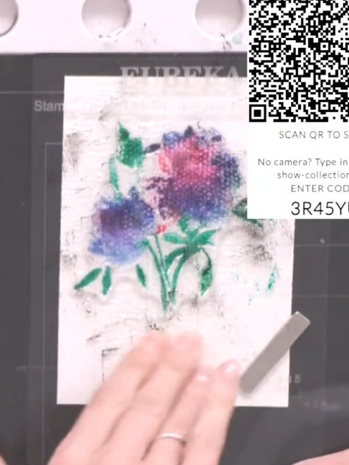 Step 7: Dry the coloured floral design thoroughly using a heat gun, moving it over the entire stamped area until the w