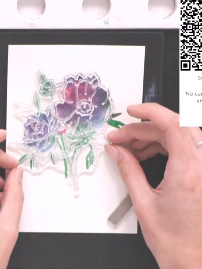 Step 8: Stamp the outline portion of the Celebrate stamp in black ink over the dried watercoloured floral design, posi