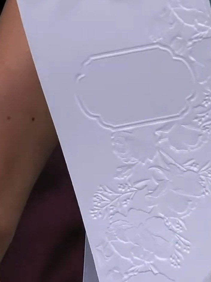 Step 4: Apply white ink pad lightly across the embossed frame and flower areas using a tapping motion. Work gently to 