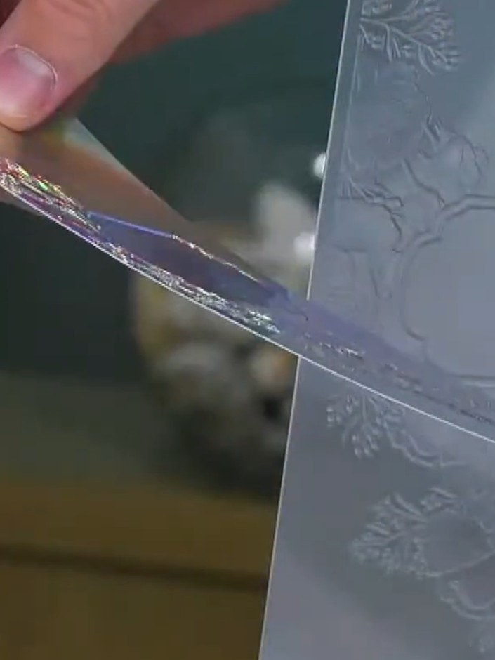 Step 6: Use a damp brush to add water to the white ink, creating additional texture and softening the ink effect on yo