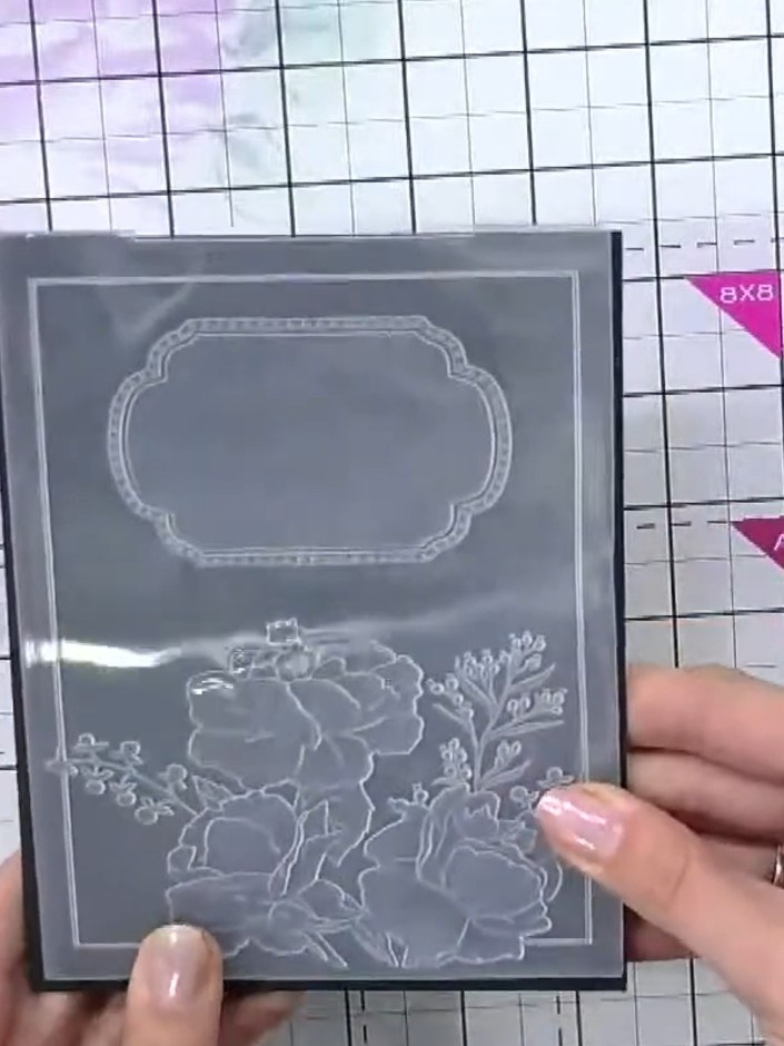 Step 1: Place the 5x7 embossing folder with the floral design into your die-cutting machine and run it through to embo