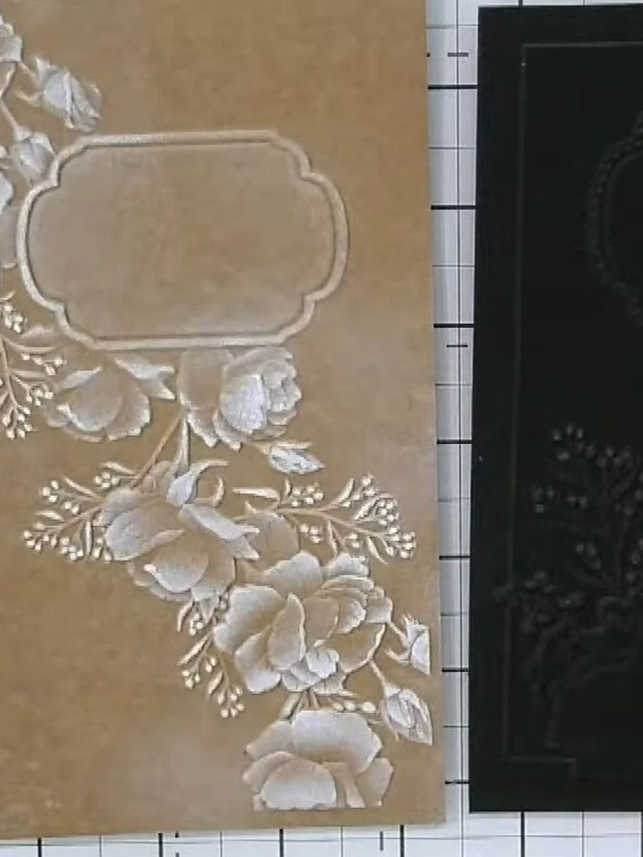 Step 4: Gently buff the gilding wax with your finger or a soft cloth to create a polished metallic finish on the embos