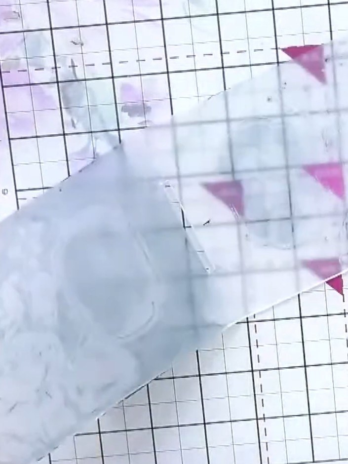 Step 2: Apply blue ink pad to both sides of the embossing folder, gently smooshing the ink pad over the raised design 