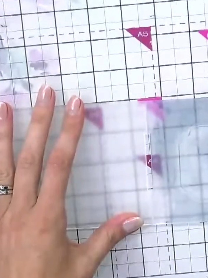 Step 4: Place your inked and wet card into the embossing folder. Run the folder through your die-cutting machine to em