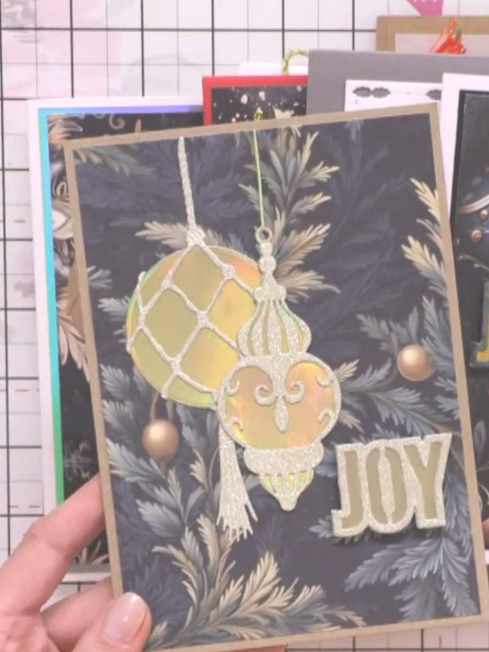 Step 6: Mount the decorated bauble element onto your card base using foam pads for dimension. Position the gold bauble