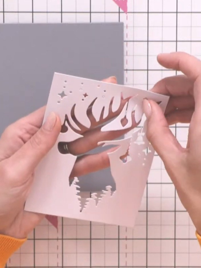 Step 2: Save the waste piece from the reindeer die-cut, as it creates a beautiful stencil effect showing the silhouett