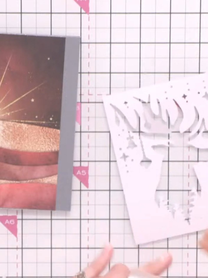 Step 5: Adhere the patterned paper featuring the sunset scene to your grey card base using a tape runner.