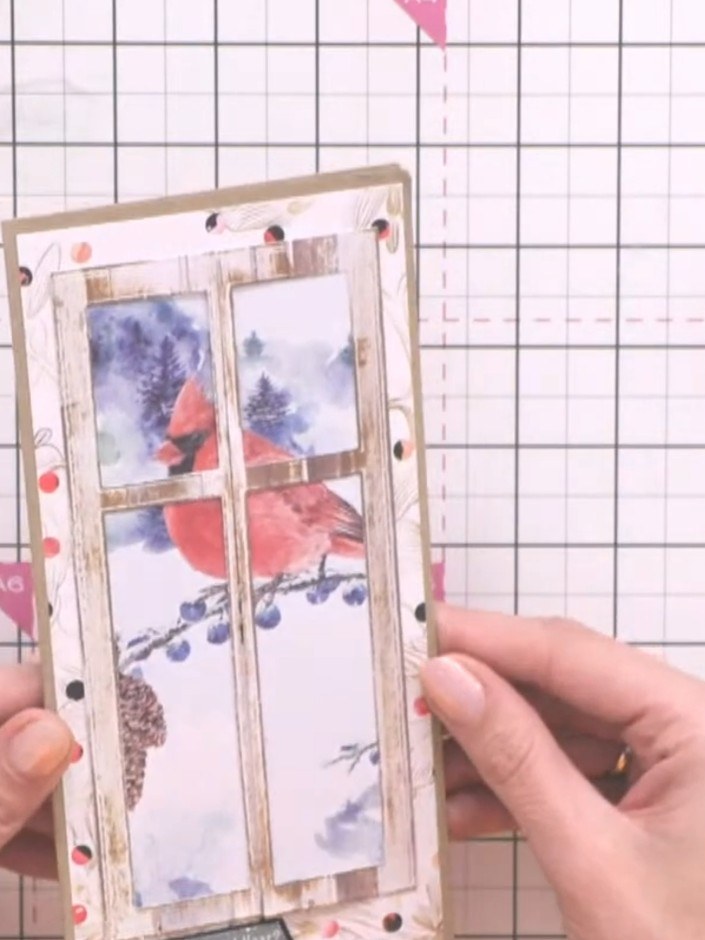 Step 6: Adhere the window design onto your card base using adhesive. Position it centrally on the front of the card an