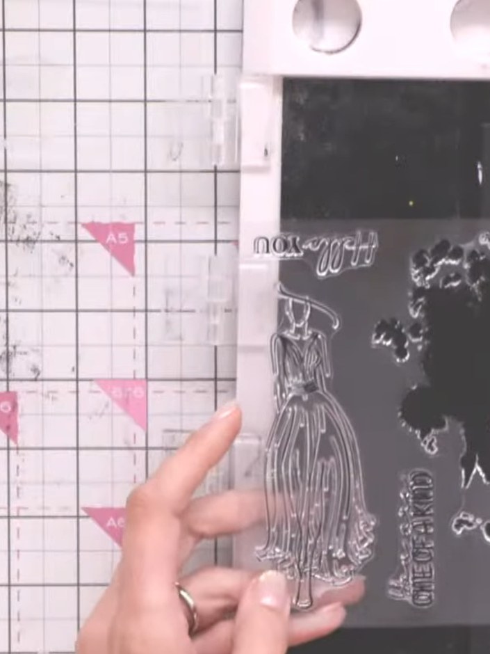 Step 1: Take the solid portion of the lamination gown stamp and ink it with the corner of your ink pad in your first c
